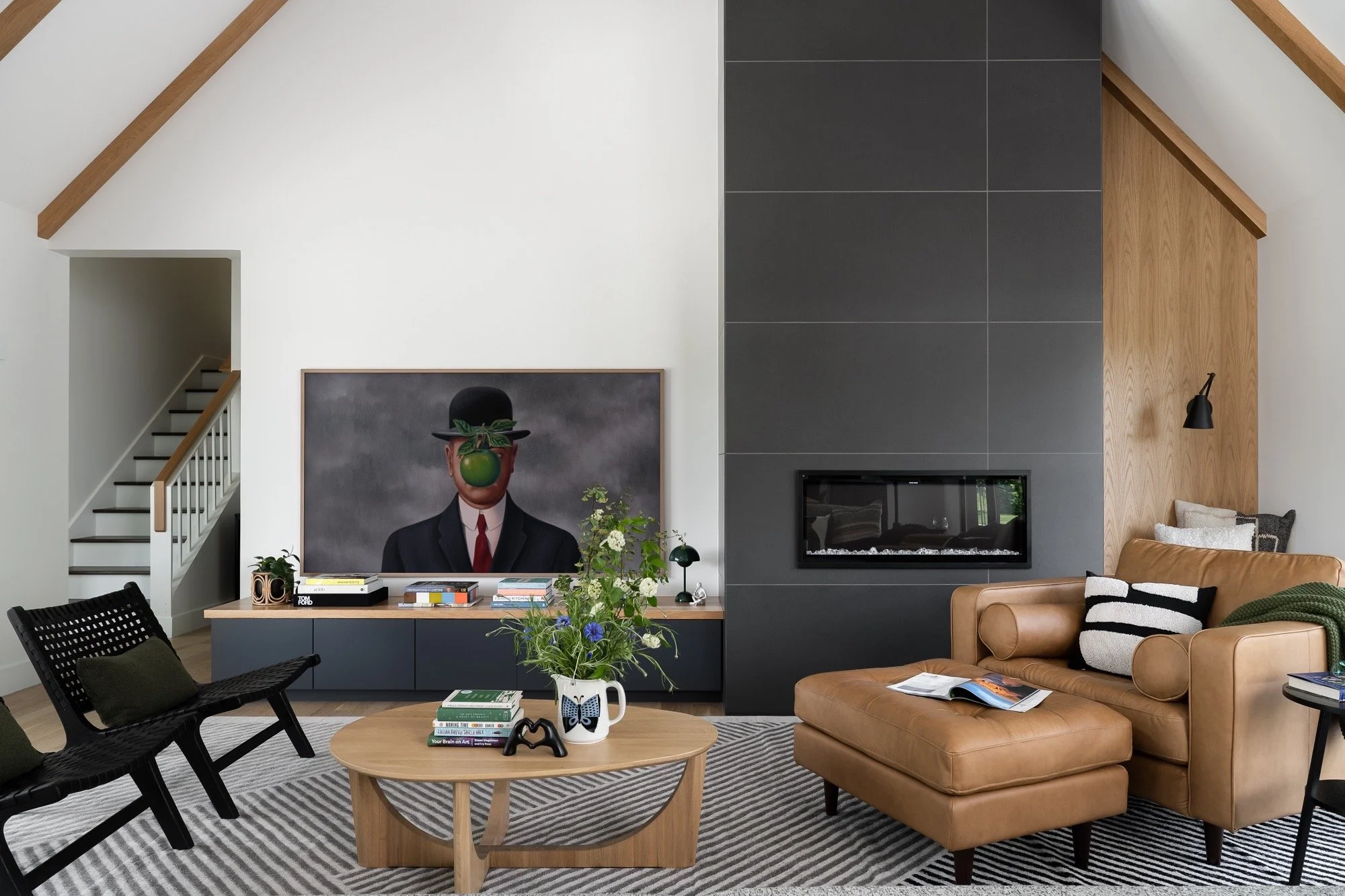 modern-living-room-fireplace-exposed-beams-leather-furniture-central-indiana-design.jpg