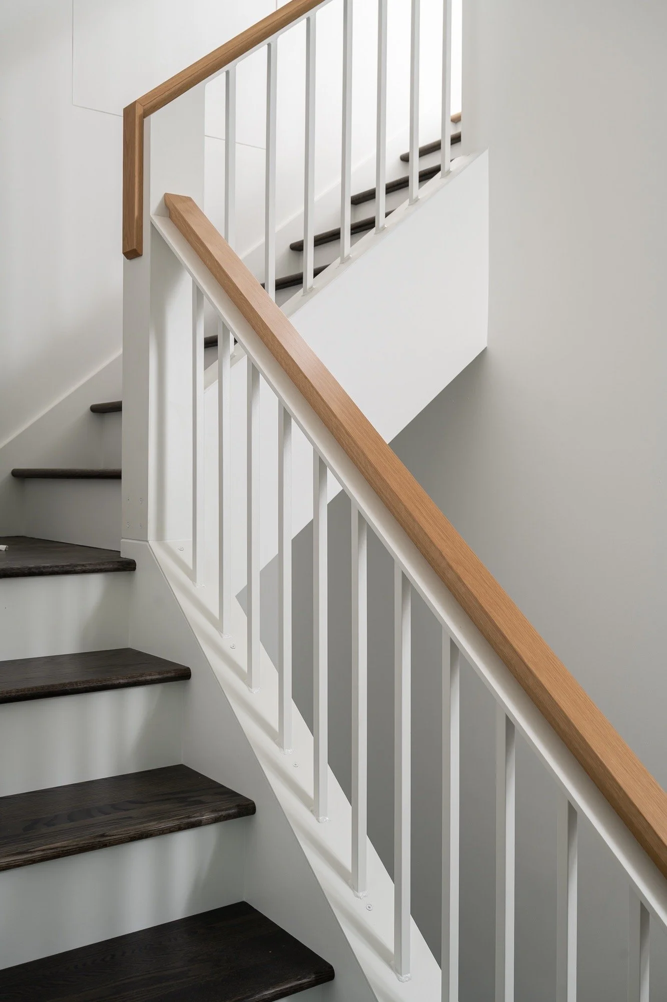 staircase-design-wood-handrail-white-spindles-modern-farmhouse-central-indiana.jpg