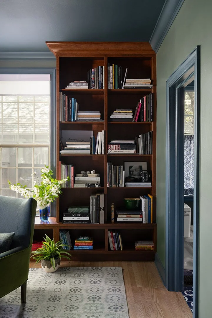 a-good-vintage-office-library-bookshelves-green-velvet-chair.jpg