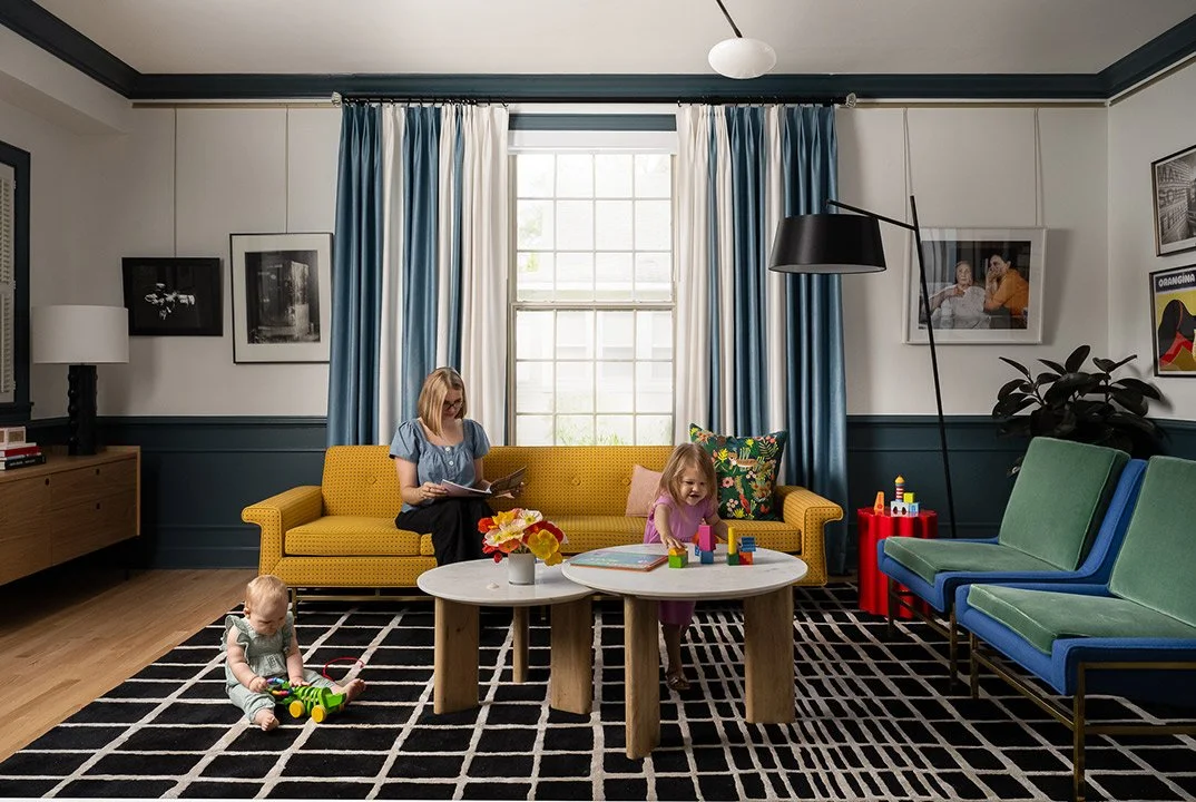 a-good-vintage-living-space-sofa-pillows-rug-light-fixture-kids-family.jpg