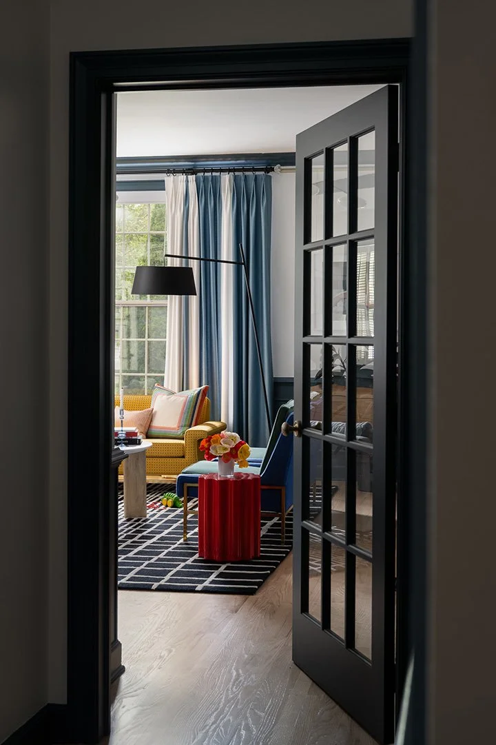 a-good-vintage-living-room-view-through-black-doorway.jpg