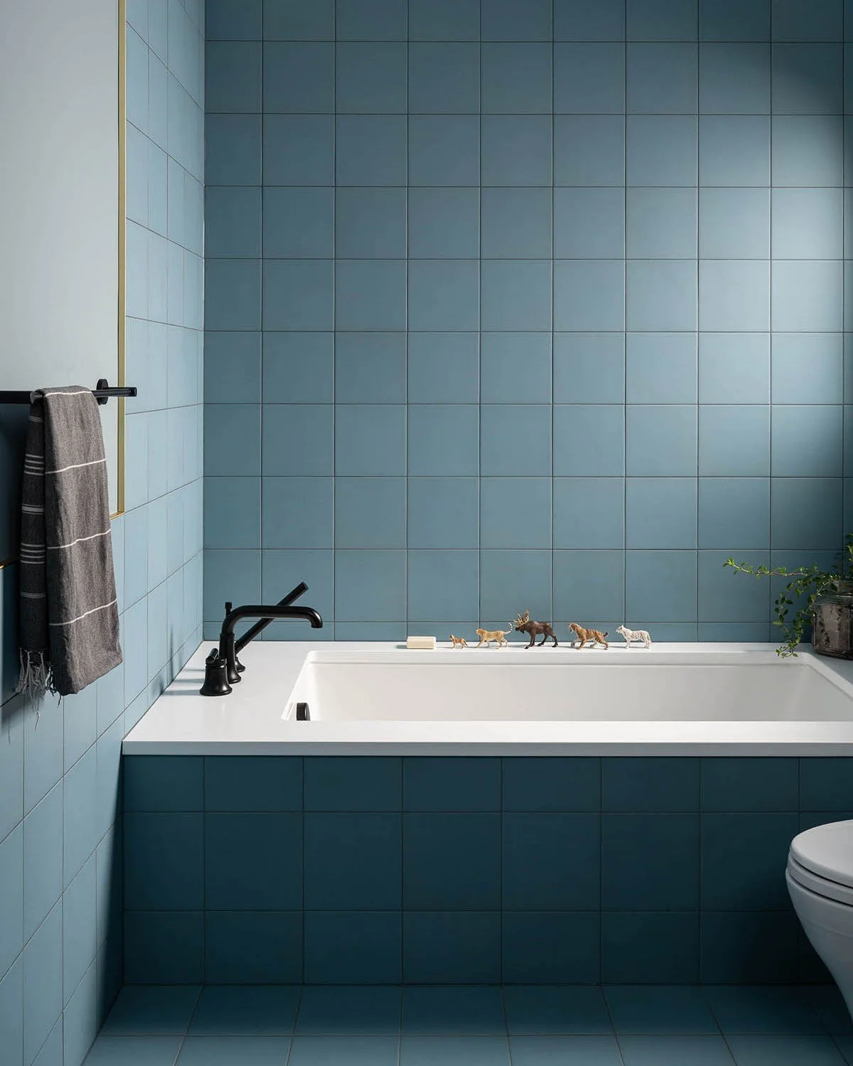 Honestly, this is one of my favorite bathrooms ever. It went through many design iterations, including various options with rainbow colors on the floor and a gradation of warm tones that we all loved but didn't quite make the cut. This @daltile porce