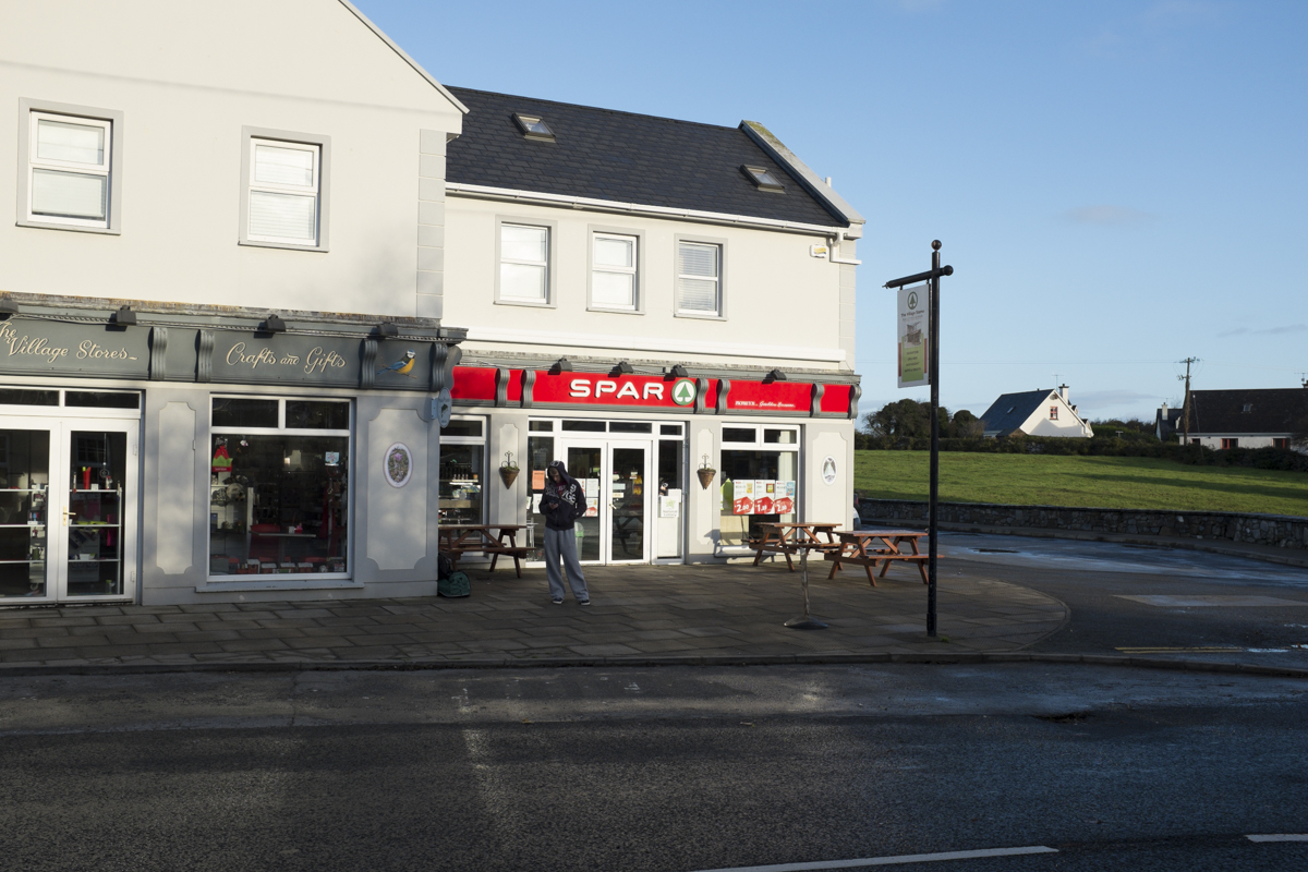 The bus stop is in front of the "Spar" small grocery chain - much like 711.