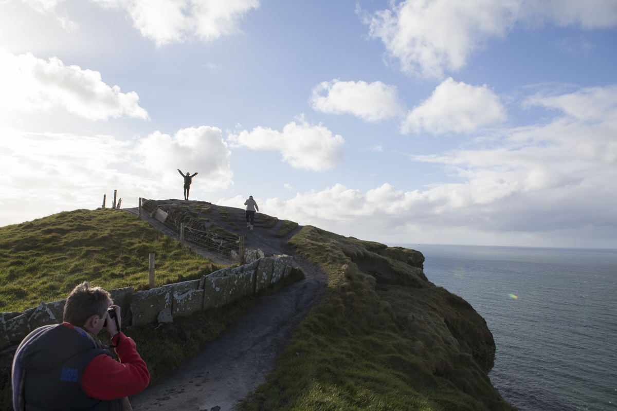People posing up on the edge of the cliff. It gets pretty windy up there. She was brave as she was also wearing 3 inch heel boots. 