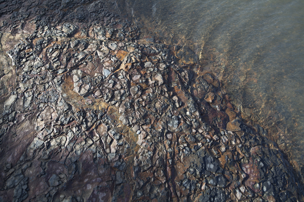 Some nice rocks near a pool.