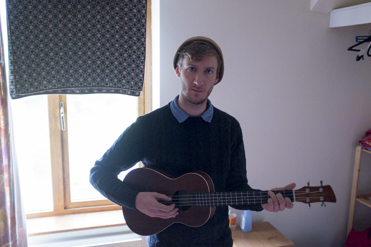 Matt playing a ukulele Jeff bought on his time here.