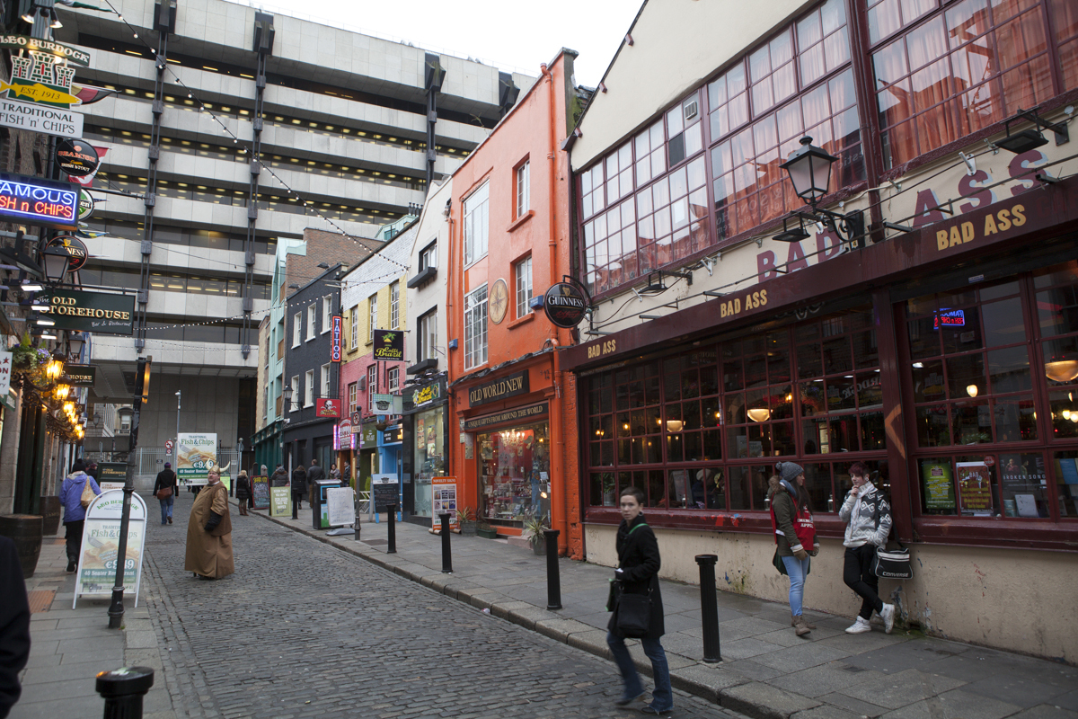 Temple bar area. The streets are small and cobblestone. There's this viking dude hawking chicken wings or something or other.