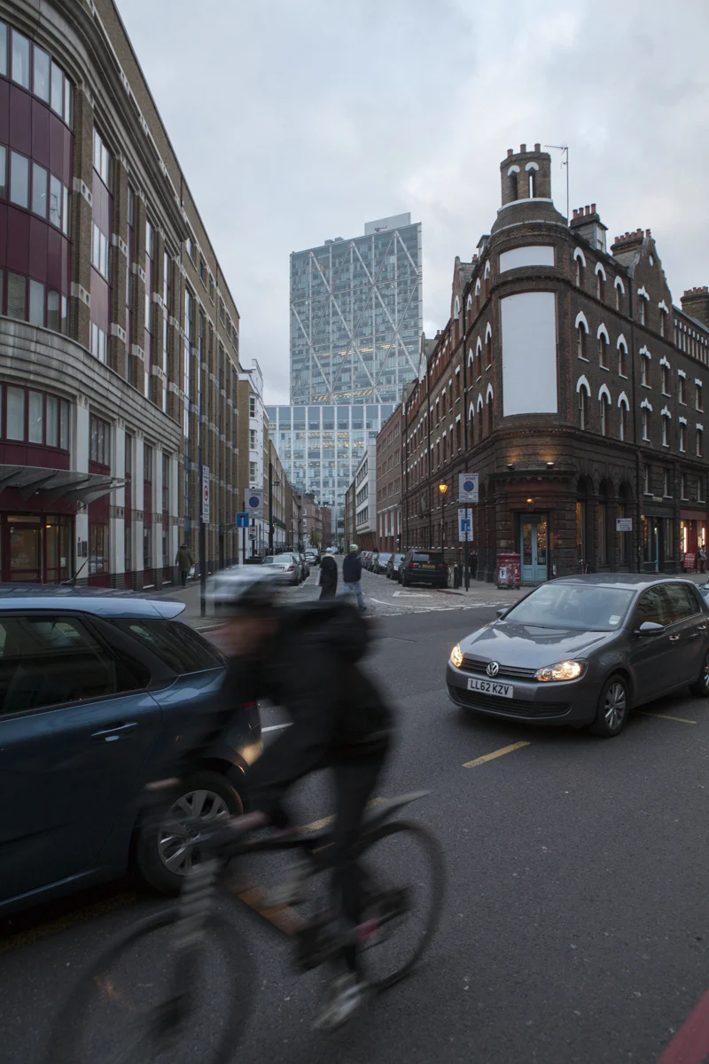 Loads of bikers travel commuter style in London.