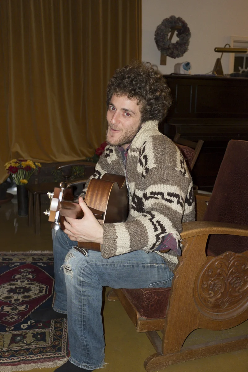 Asher strumming.