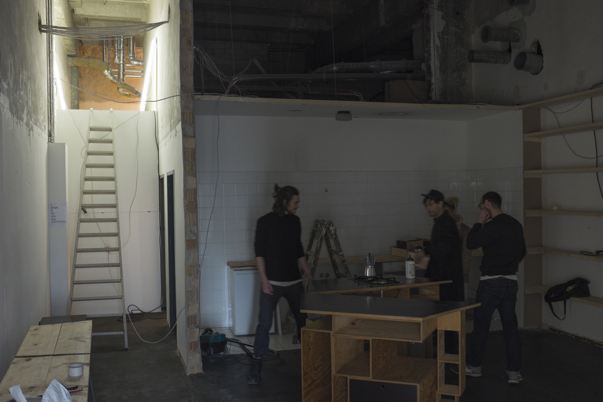 Dudes setting up the kitchen. The found this place for a crazy deal and have started rennovating and tearing out walls and ceilings.