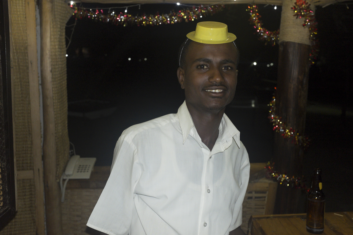 We took the canoe out at night and crashed the African Lodge's party. This was the bartender.
