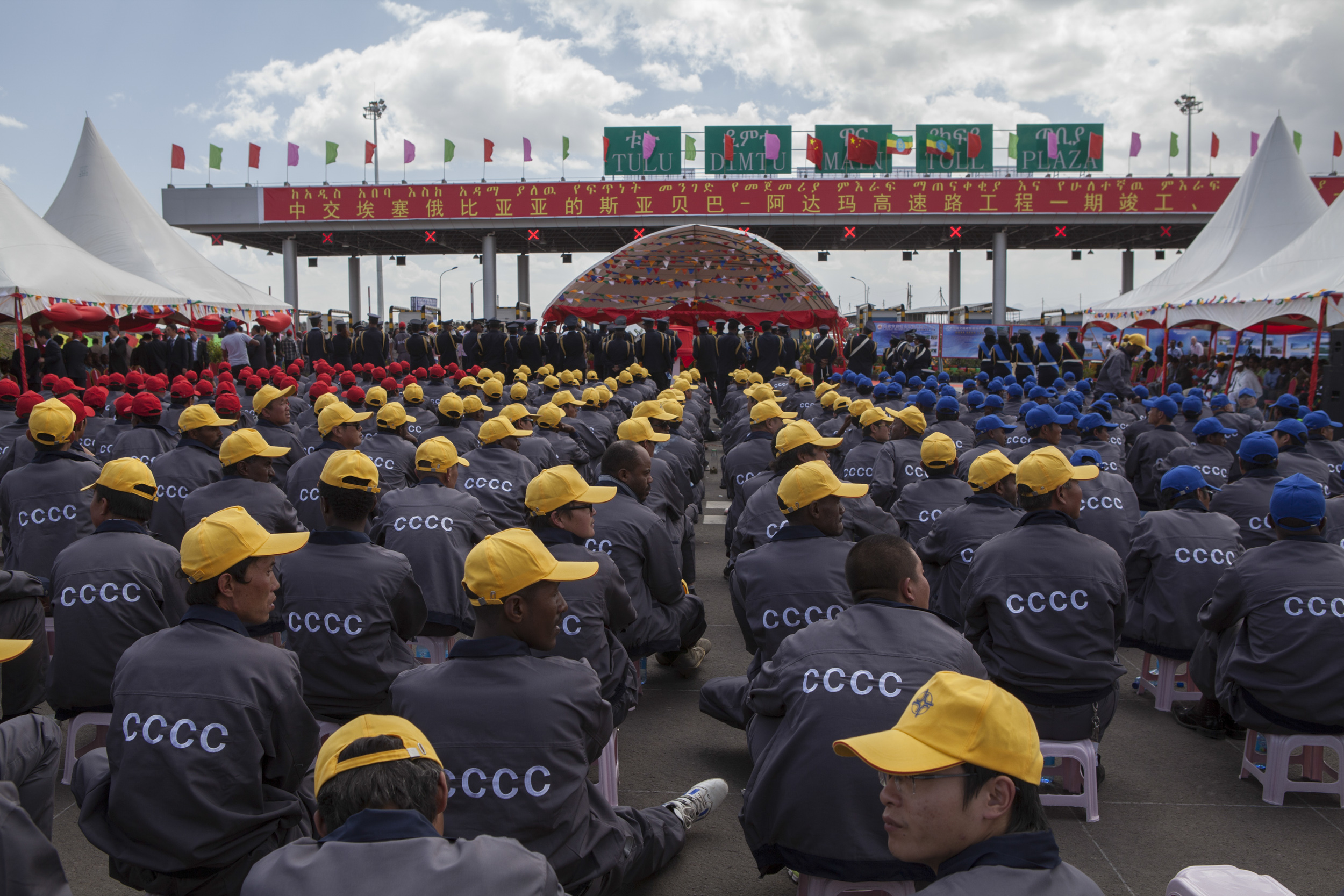   Ethiopian and Chinese workers of the China Communication Construction Company sit at the site of the Addis Ababa-Adama toll road on May 5, 2014. The site was christened by Chinese Prime Minister Li Keqiang. Li arrived in Ethiopia for the start of a