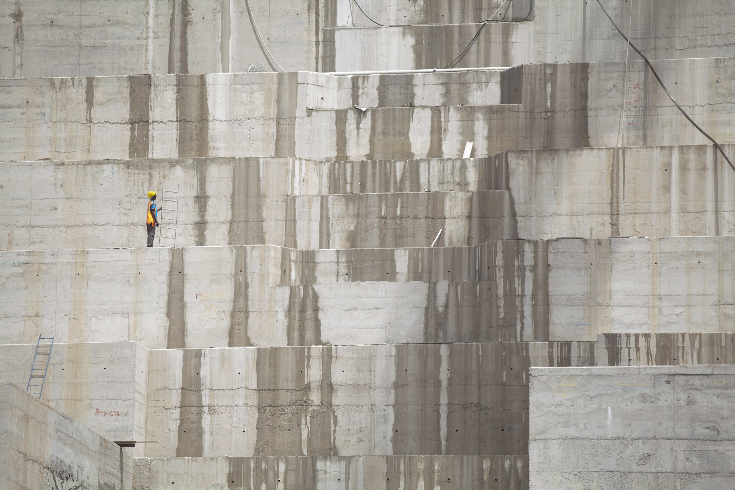  Ethiopian workers are pictured on site at the Great Ethiopian Renaissance Dam on 31 April 2015. Once completed the Ethiopian Dam, and the biggest in Africa will produce around 6000 MW of power, both for export and internal use. AFP Photo / Zacharias