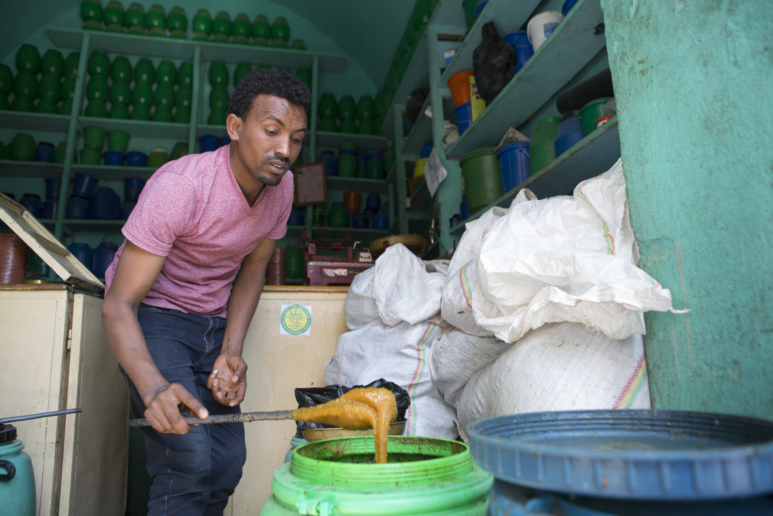  Haile Gebru, honey shop keeper, in Mekelle in the Tigray region of northern Ethiopia, is pictured on 30 March 2017, preparing honey to be sold to some customers. Tigray is well known for producing honey, though not enough for Ethiopia to make it a m