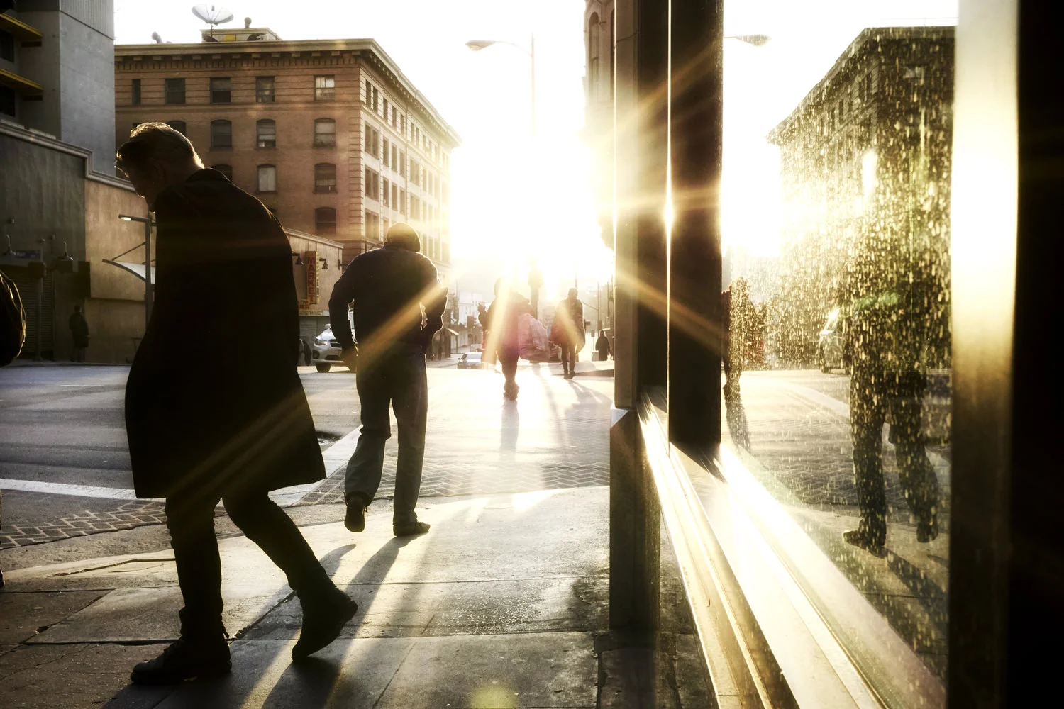 homeless-and-commuters-shuffle-along-broadway-at-sunrise-downtown-los-angeles.JPG