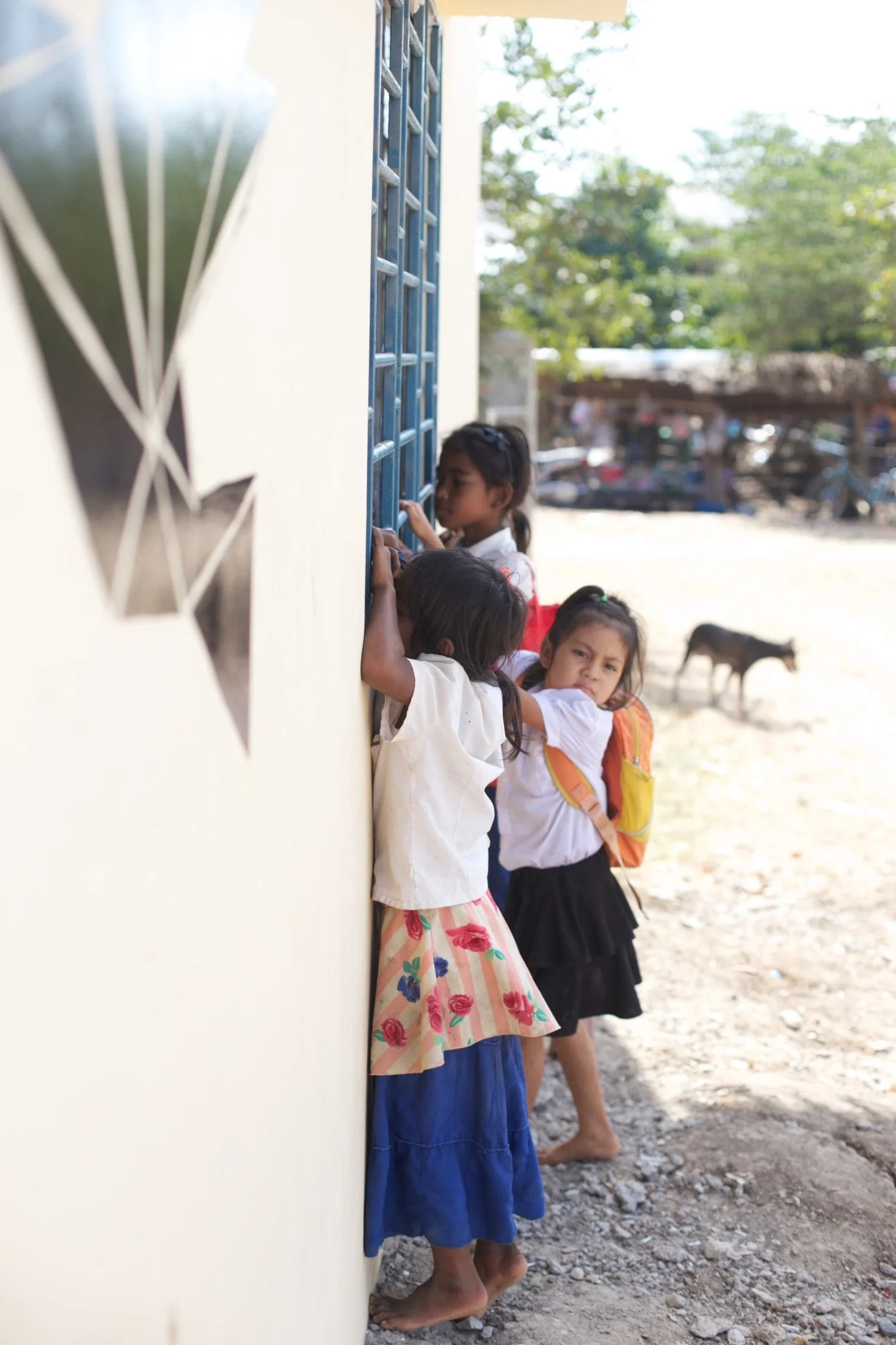 Children of The MineField Village peeking into Landmine Design 