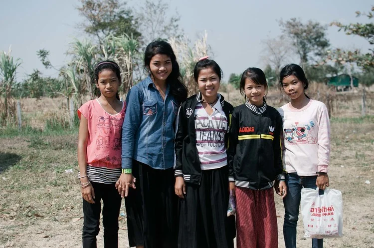 The school aged girls in the program leaving for school after a morning with LandMine Design. Srey Mom is second from the left, Volek stands beside her in the middle, and Som Poa is all the way on the right.