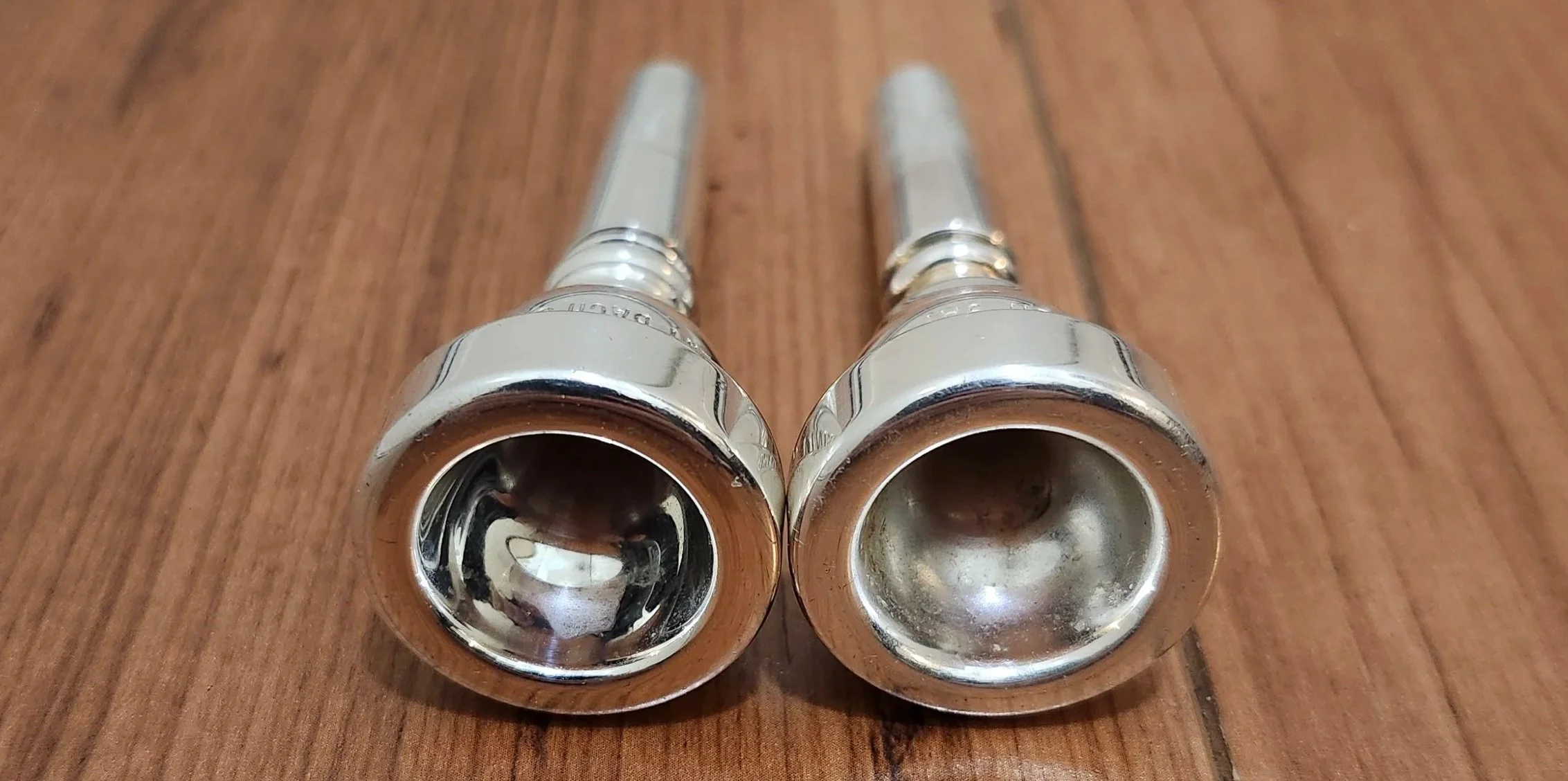 Bach 9AT rims. Similar, but the older one (left) feels noticably sharper on the face.