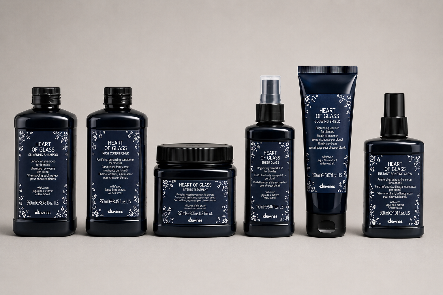 Davines Heart of Glass collection including Silkening Shampoo, Intense Treatment, Rich Conditioner and Sheer Glaze for blonde hair, available at Salon DeCota, San Rafael CA.