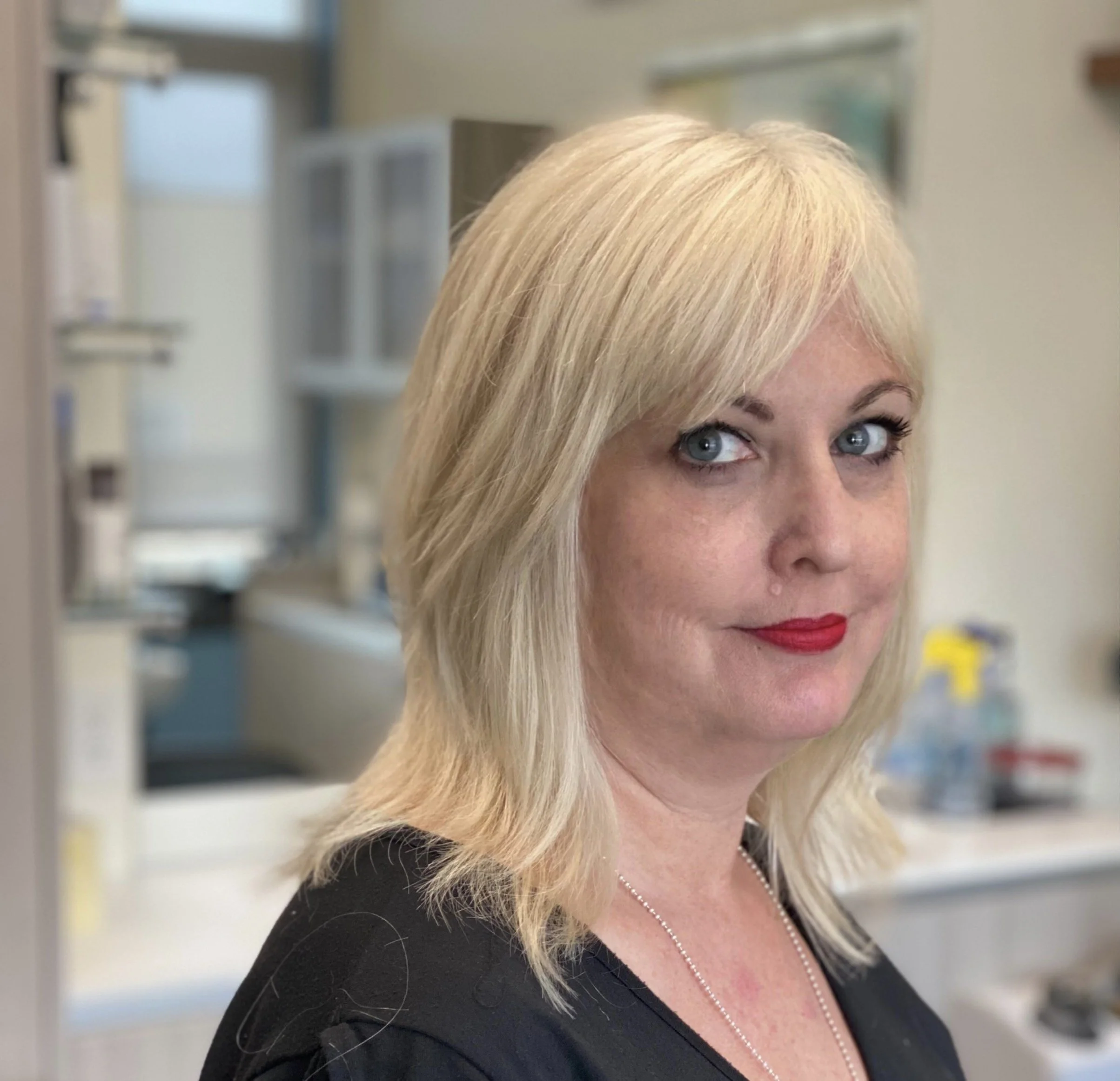 Platinum blonde shag cut with soft fringe and layered ends by Evet DeCota at Salon DeCota, San Rafael CA.