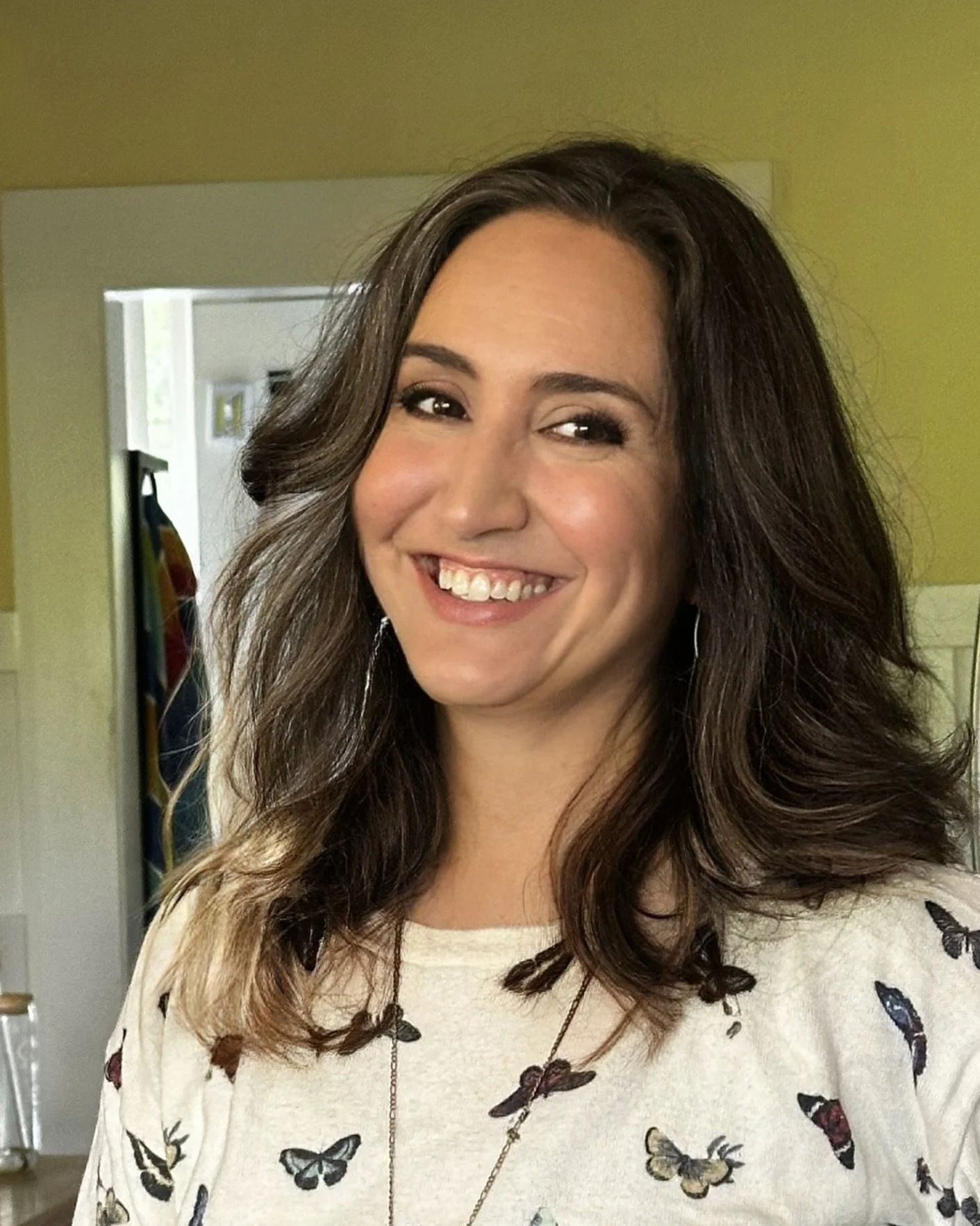 Long layered haircut with soft waves and natural movement, styled by Evet DeCota at Salon DeCota, San Rafael CA.