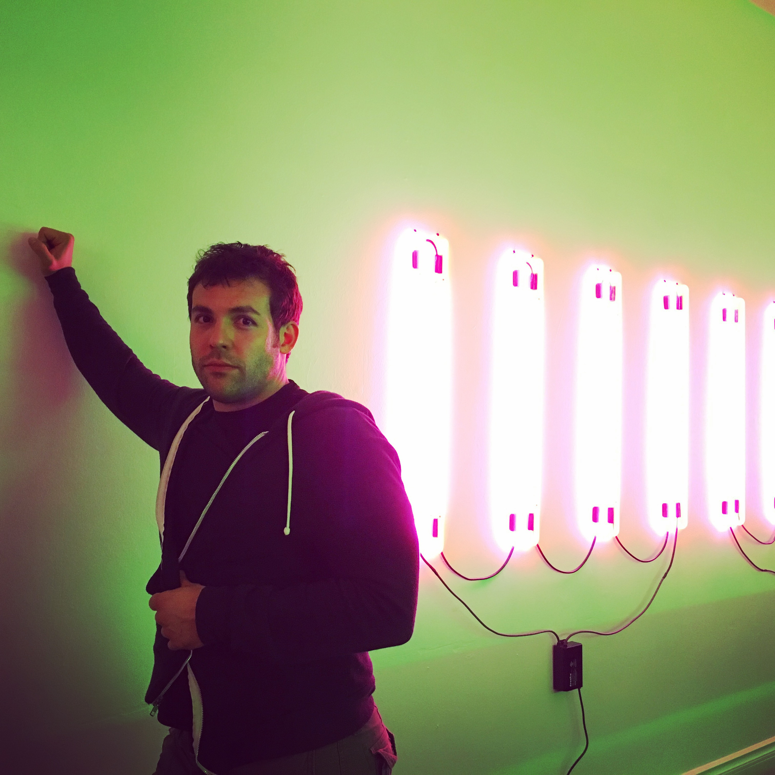 Scotty hanging out in front of his work