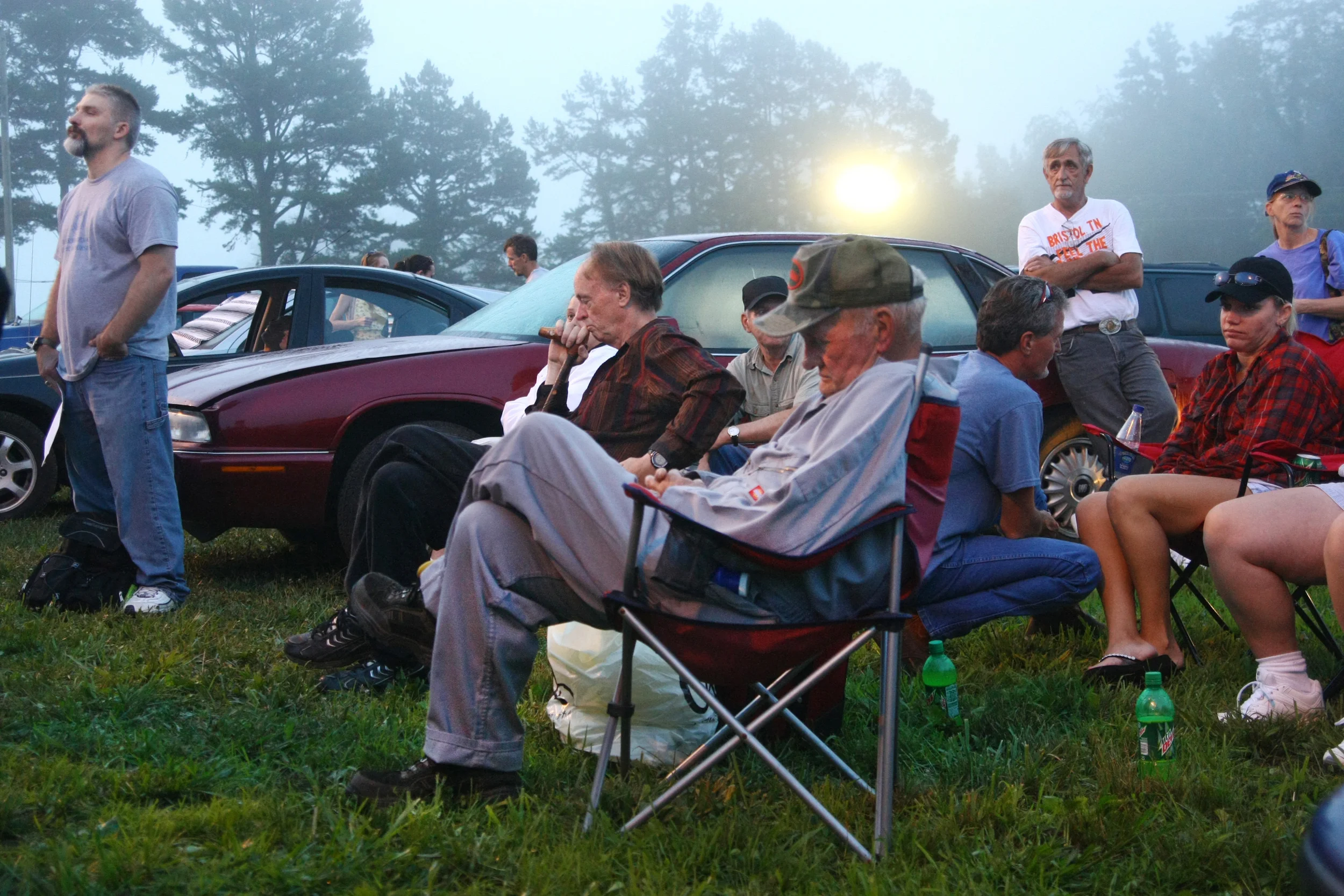  Waiting for their number to be called outside the gates. 
