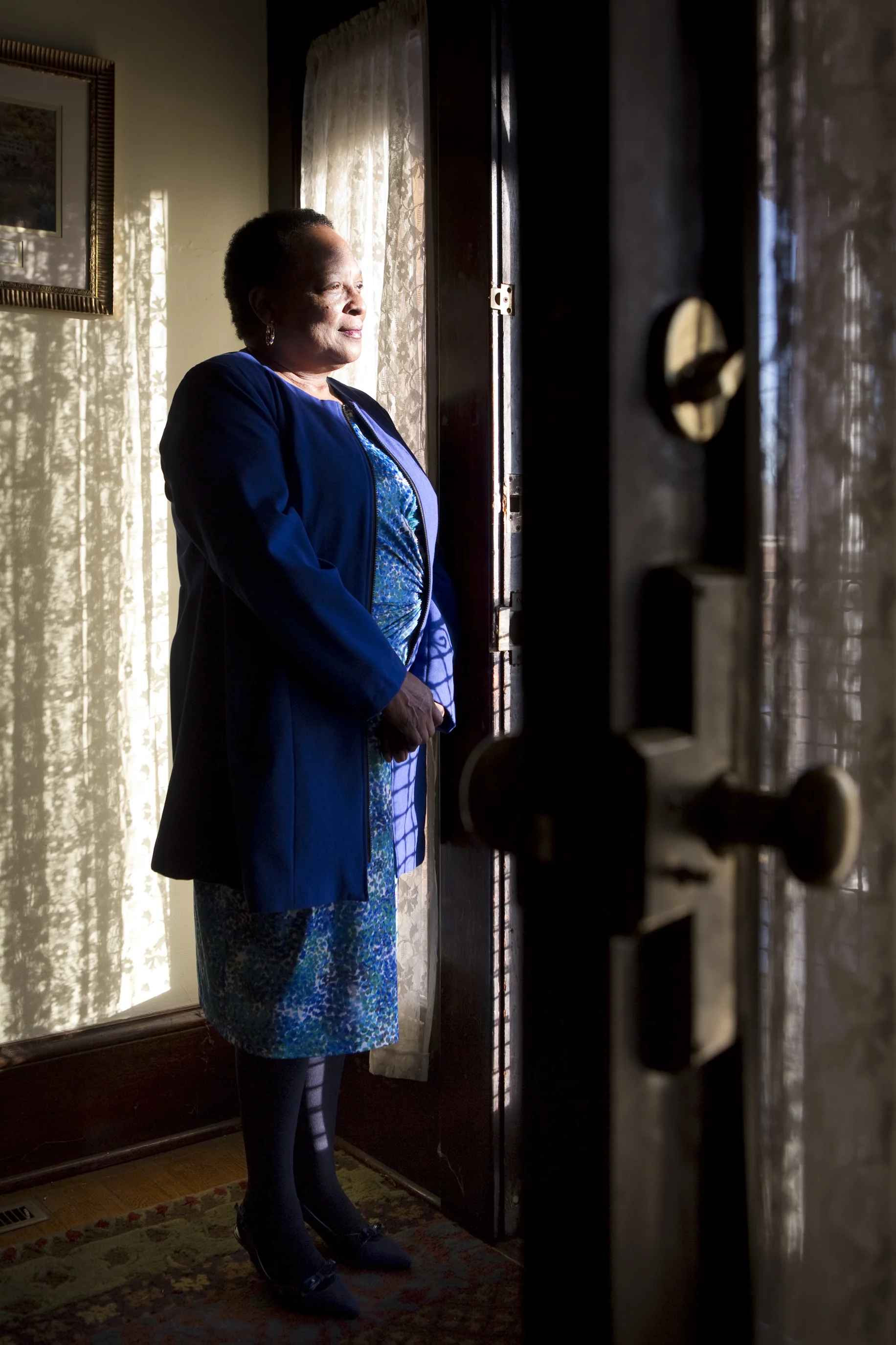  Dorothy Owsley stands at the front door of the transitional home that she will run on Patterson Avenue SW on Thursday, Dec. 11, 2014. The home is set to open on Feb. 2 and will serve eight women being released from prison looking for a safe environm