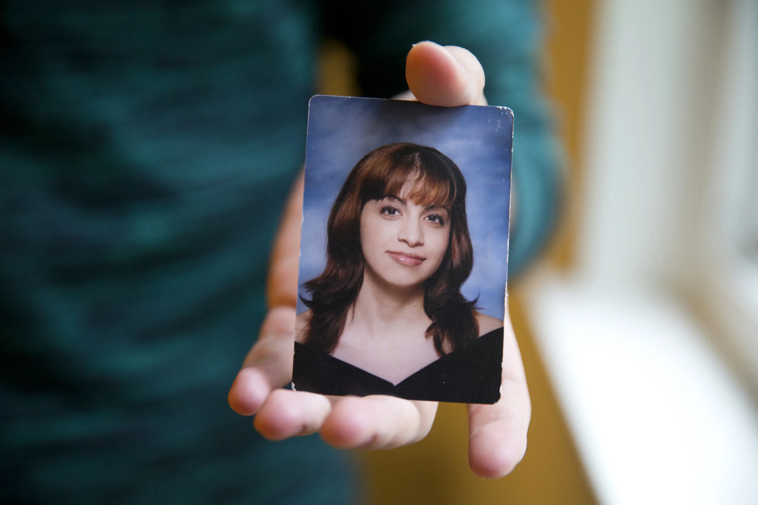 Younes holds a senior portrait picture of himself in high school when he was formerly Mariam. Being beautiful equated to becoming a good daughter in Younes' experiences with his family. "All I knew was that I was a girl and I had to be a girl and inside, I didn't feel that way," he said.