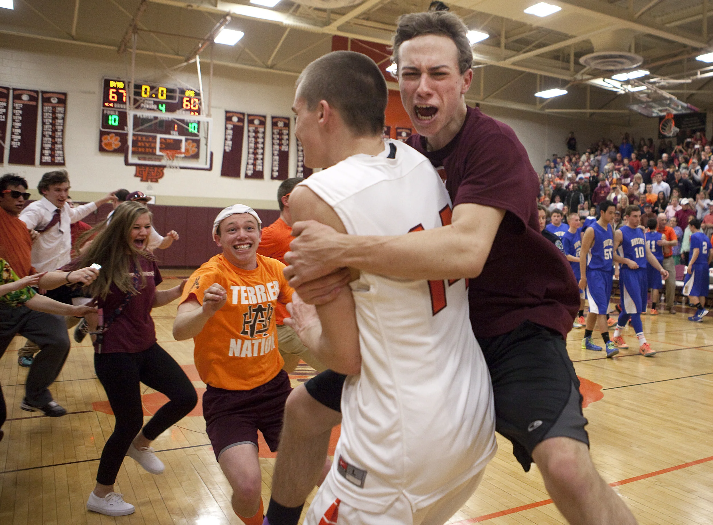  William Byrd High School students celebrate their win over Blackburg High School after the the first round of the 3A West tournament at William Byrd High School. William Byrd won 67-60. 