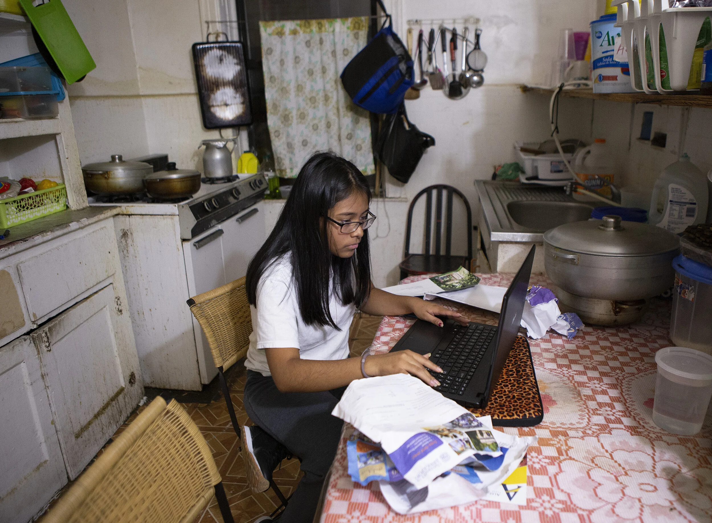  Sebastiana Lopez works on her homework and looks through mail sent from different colleges while in her kitchen at home in Queens Friday evening, Oct. 11, 2019 after rowing practice late in the evening. Lopez is a coxswain for Row New York. Lopez sa