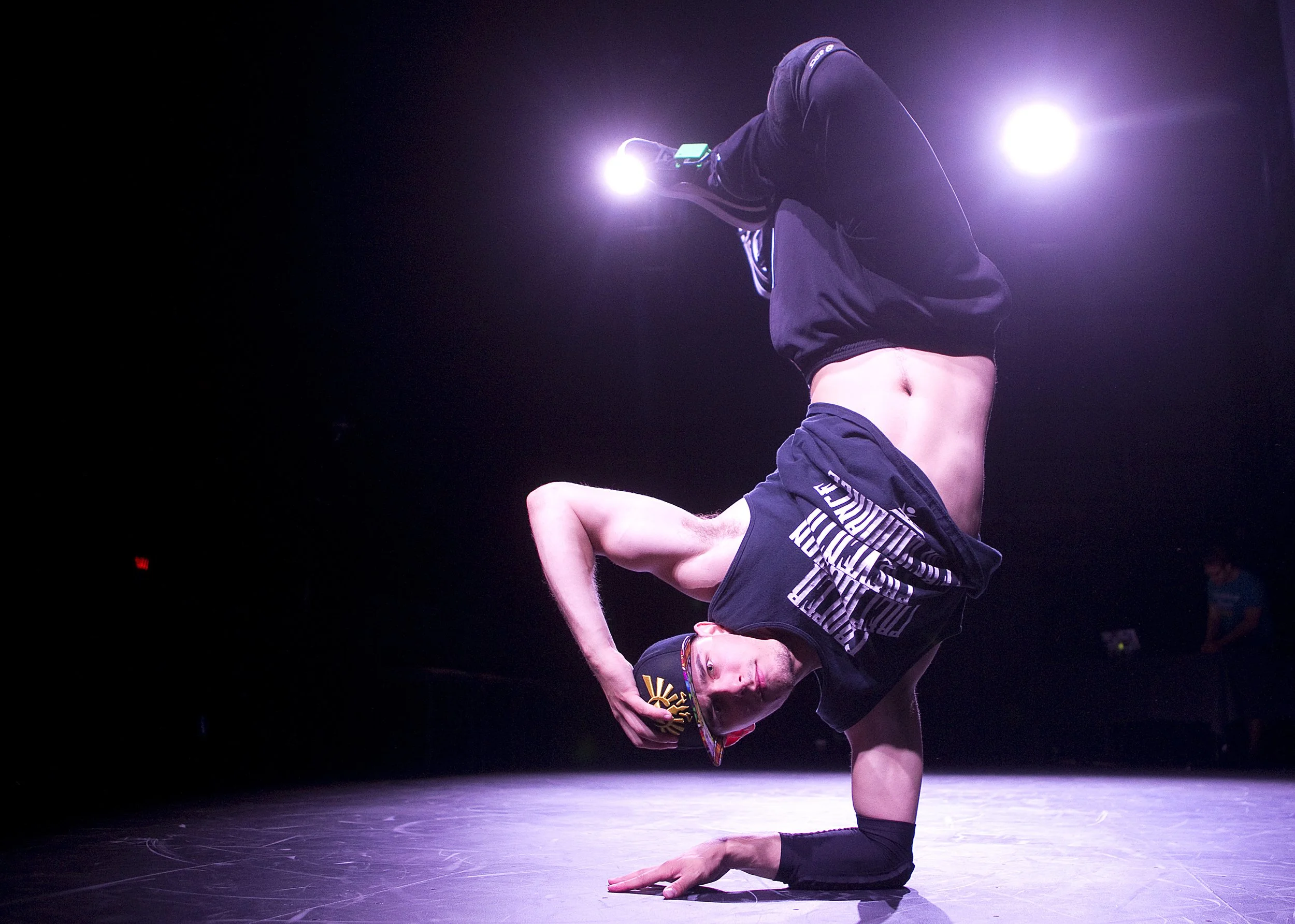  Garrett Szydlowski, 25, the founder of Random Ninjaz, dances with sensors on his shoes made by Electroskip during a rehearsal for Cube Fest at the Moss Arts Center in Blacksburg. 
