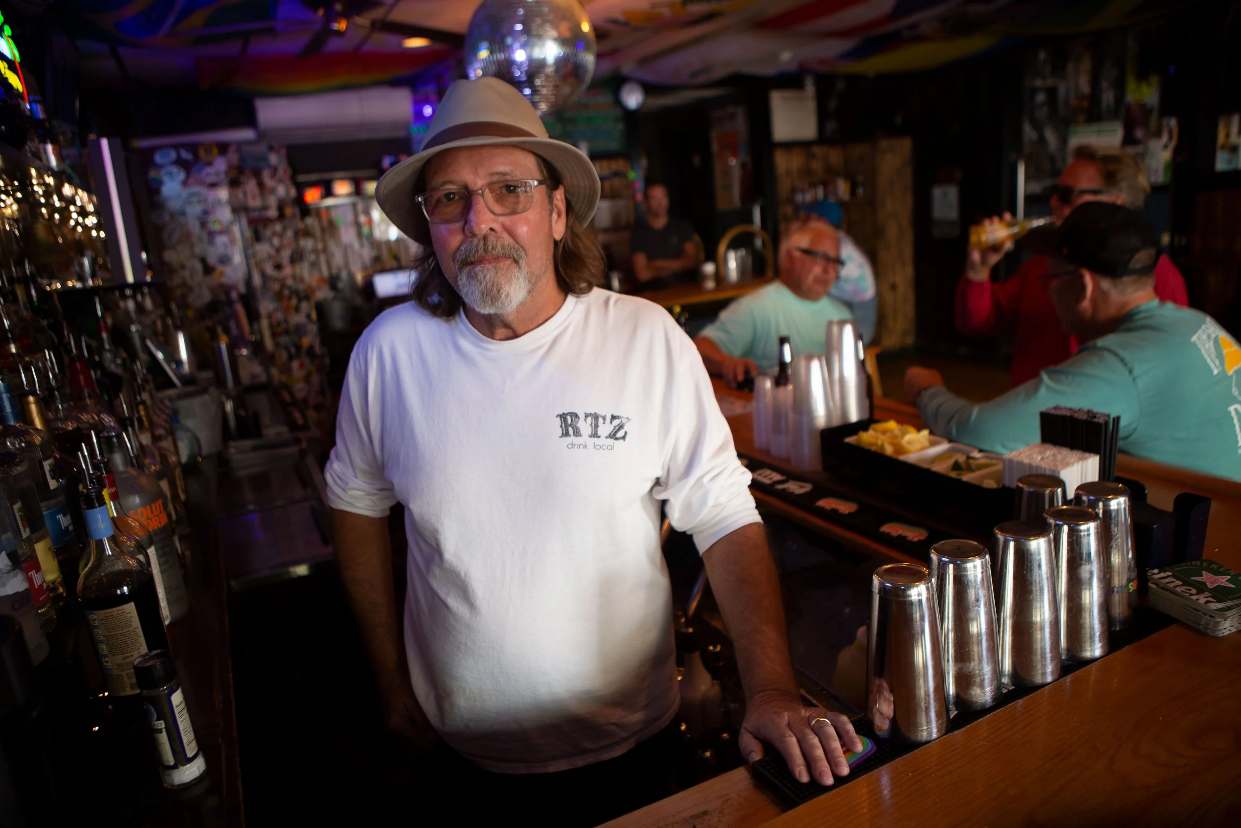  Larkin Stallings, owner of the Ritz Cafe in Oak Bluffs on Martha’s Vineyard, stand in his bar. Stallings and his wife Jackie jumped in to help volunteer when 50 migrants arrived on two planes to the island sent by Gov. Ron DeSantis in September of 2