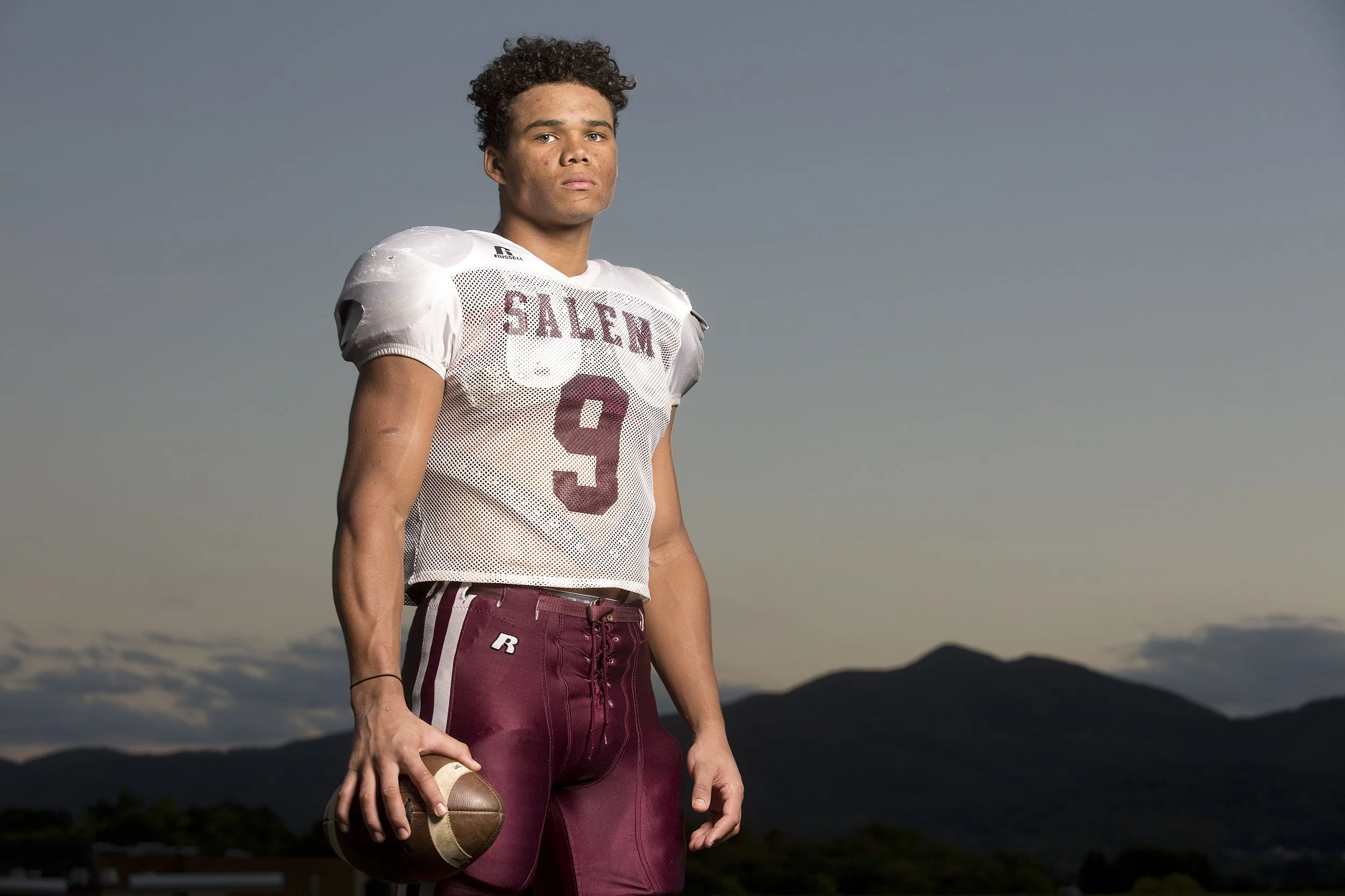  De'Angelo Ramsey is a running back and defensive end for Salem High School and poses for a portrait on their practice field. 