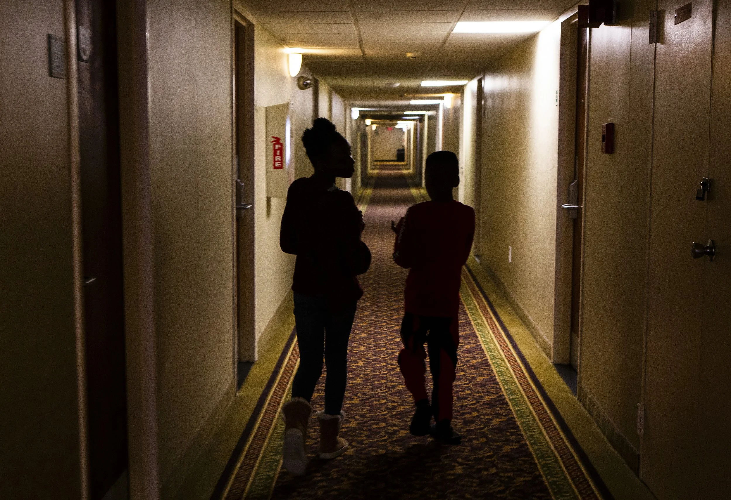  Dakota Skye, 10, and Ethan, 9, walk down the hotel hallway to buy some candy from the vending machine in the lobby on Saturday, March 7, 2020. Goode and her children have been living at the Quality Inn in Ledgewood, New Jersey for a month now. Goode