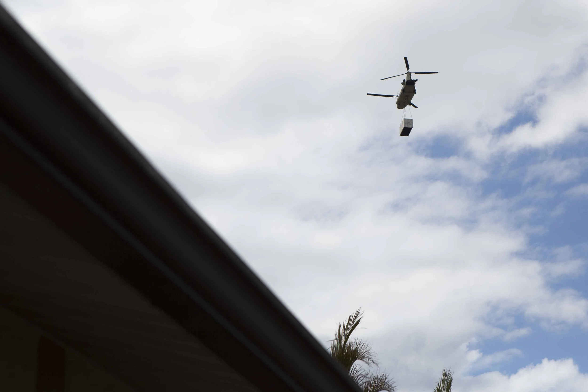  Emergency aid and storage containers attached to helicopters constantly flew in the sky during the daytime.  