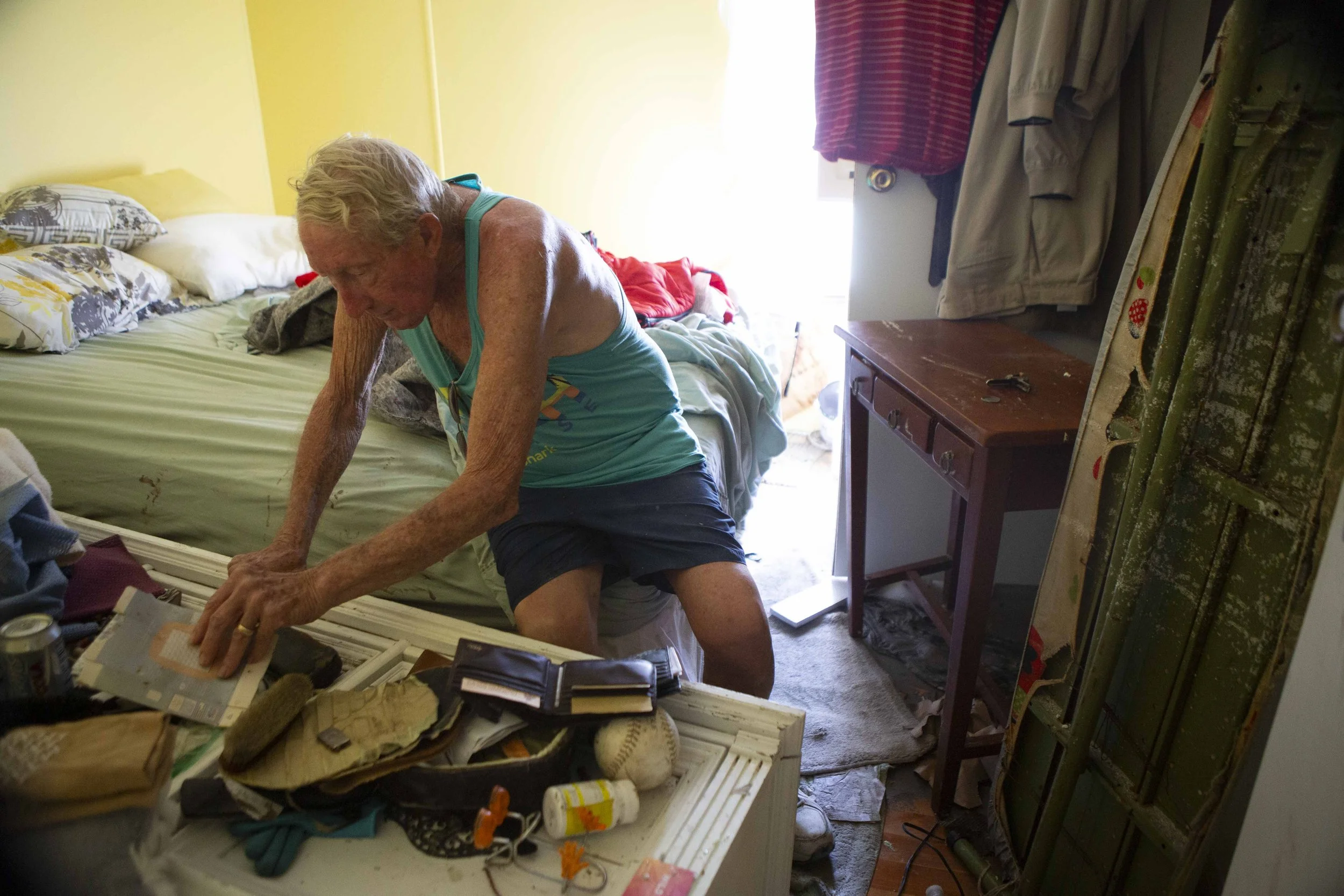  Les Pickett, 84, gathers items from a bedroom before leaving for shelter in Estero on Wednesday, October 5, 2022. The Picketts were home when Hurricane Ian hit. Water rose to their chins and their furniture began to float around them. They slept in 