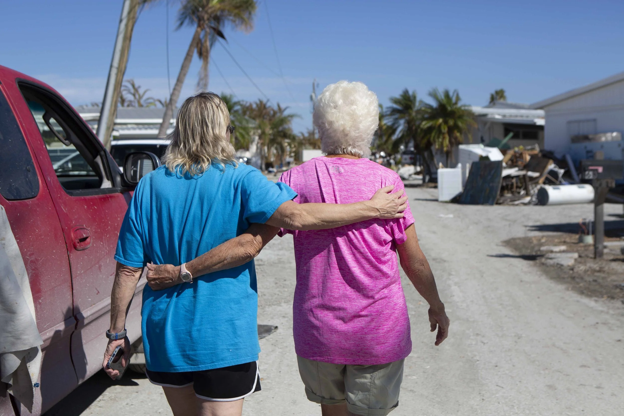  Pat Pickett, 83, greets her neighbor Kim Haefner in the San Carlos Island community on Fort Myers Beach on Wednesday, October 5, 2022.  