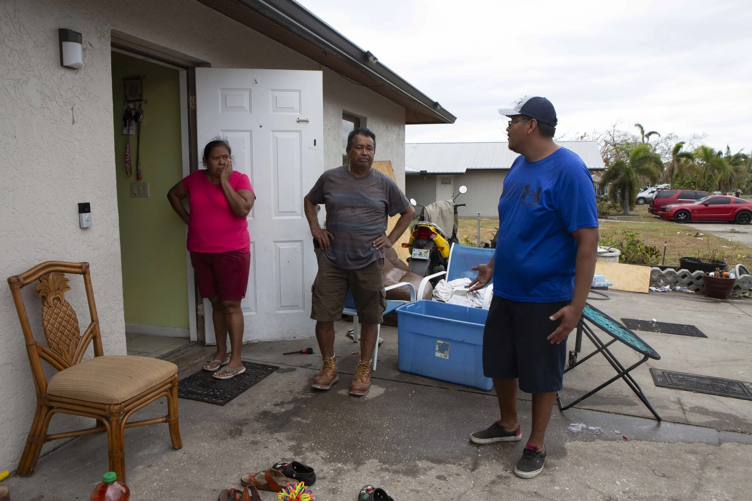  Miguel Romero says goodbye to his parents in the Linda Loma Road neighborhood of Iona on Saturday, October 8, 2022. Romero has been renting off Linda Loma Drive for 18 years. Him and his family were home when Hurricane Ian arrived. They climbed into