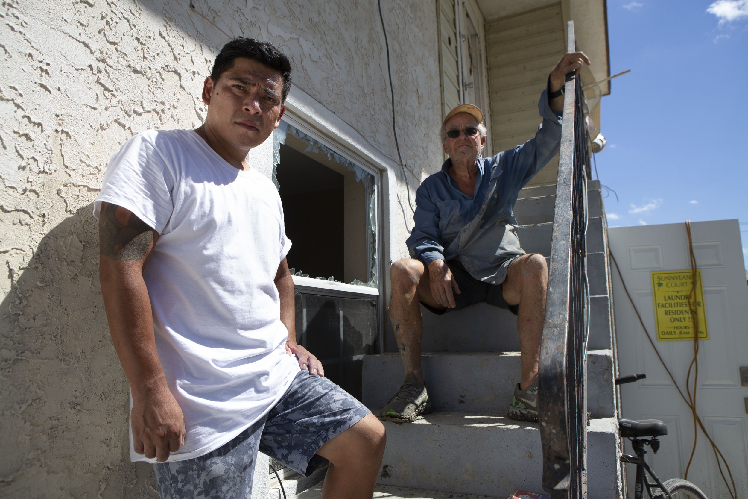 Carlos Hernandes, 37, and Robert Heather, 73, both live at Sunnyland Trailer Park in San Carlos Island, Fort Myers Beach. Carlos helped save Robert after breaking the window to Robert’s apartment, seen between them, to pull him out from drowning in 