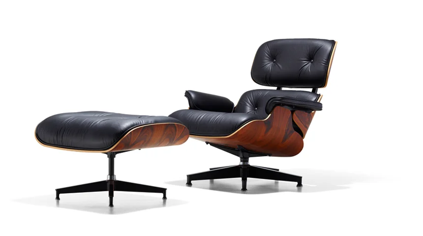 The Eames Lounge Chair. You've probably seen this all over TV. I was watching "Celebrity Game Night" (hilarious, by the way) a few nights ago and they had one. One of the players carelessly jumped on the footstool. I cringed a little. 