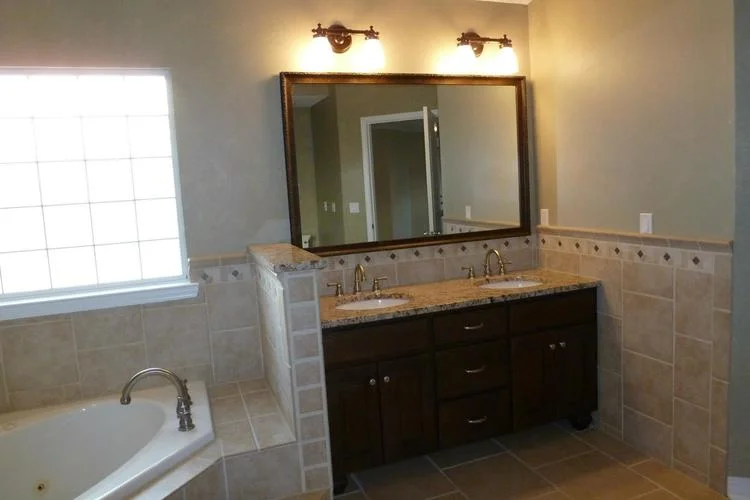 If you look at the area between the mirror and the window, you can see a bit of the faux finish previously there.