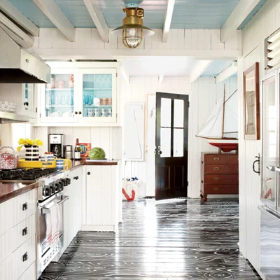 Very bold floors, but it works well in this eclectic beach cottage.