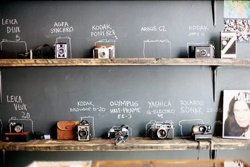 vintage camera wall photographed by Shawn Hoke, image via Mint Design Blog