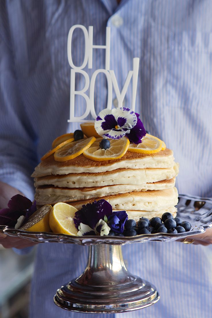 I love the idea of a brunch gathering or shower. Especially one that involved a pancake "cake" like this one featured on Camille Styles .