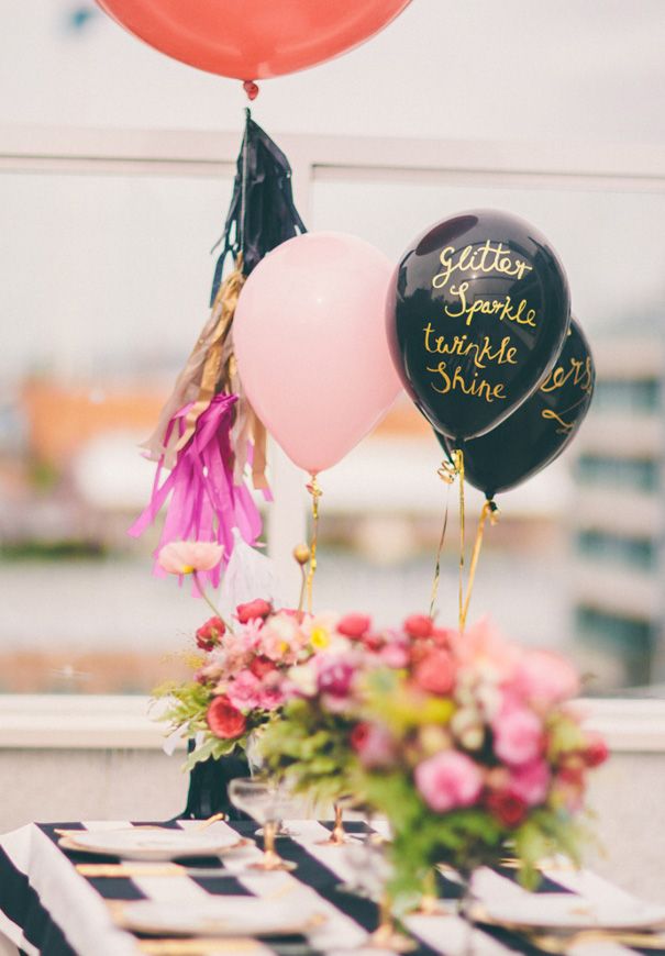 Make inexpensive mylar balloons shine with a metallic paint pen and a beautiful script (tip: recruit your friend with the best handwriting) shown here via Hello May .