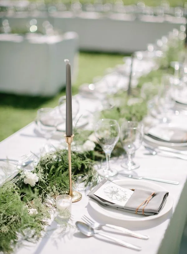 Switch up your normal table decor with changing your white tapers to gray ones.  This has bee a favorite I've seen lately.  Image via Southern Weddings
