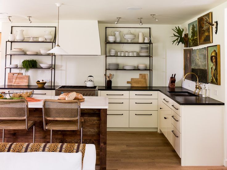 Lauren Liess has been a design icon for me for awhile, and her previous home's kitchen is a great example why. Tip: Flea markets and thrift stores are a great place to get vintage oil paintings.