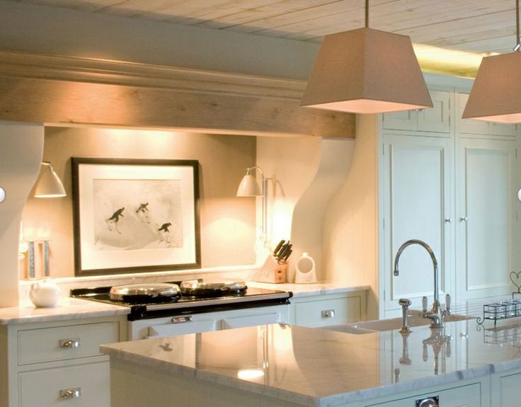 Over the stove is another great place to bring in a framed piece. (via The Paper Mulberry )