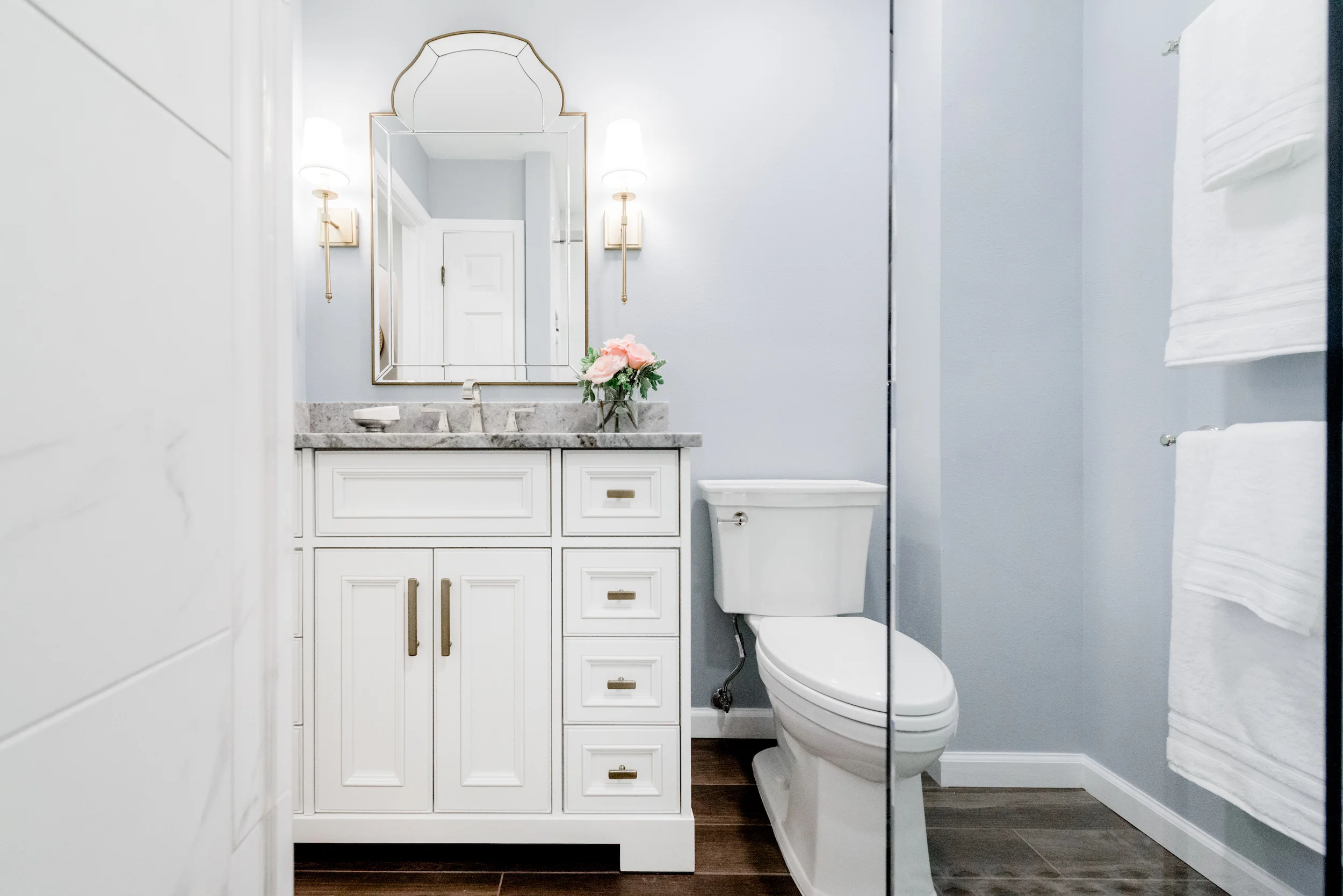light blue bathroom with white vanity.jpg